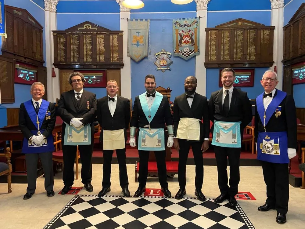 Three Worshipful Masters of Universities Scheme lodges meeting on the square